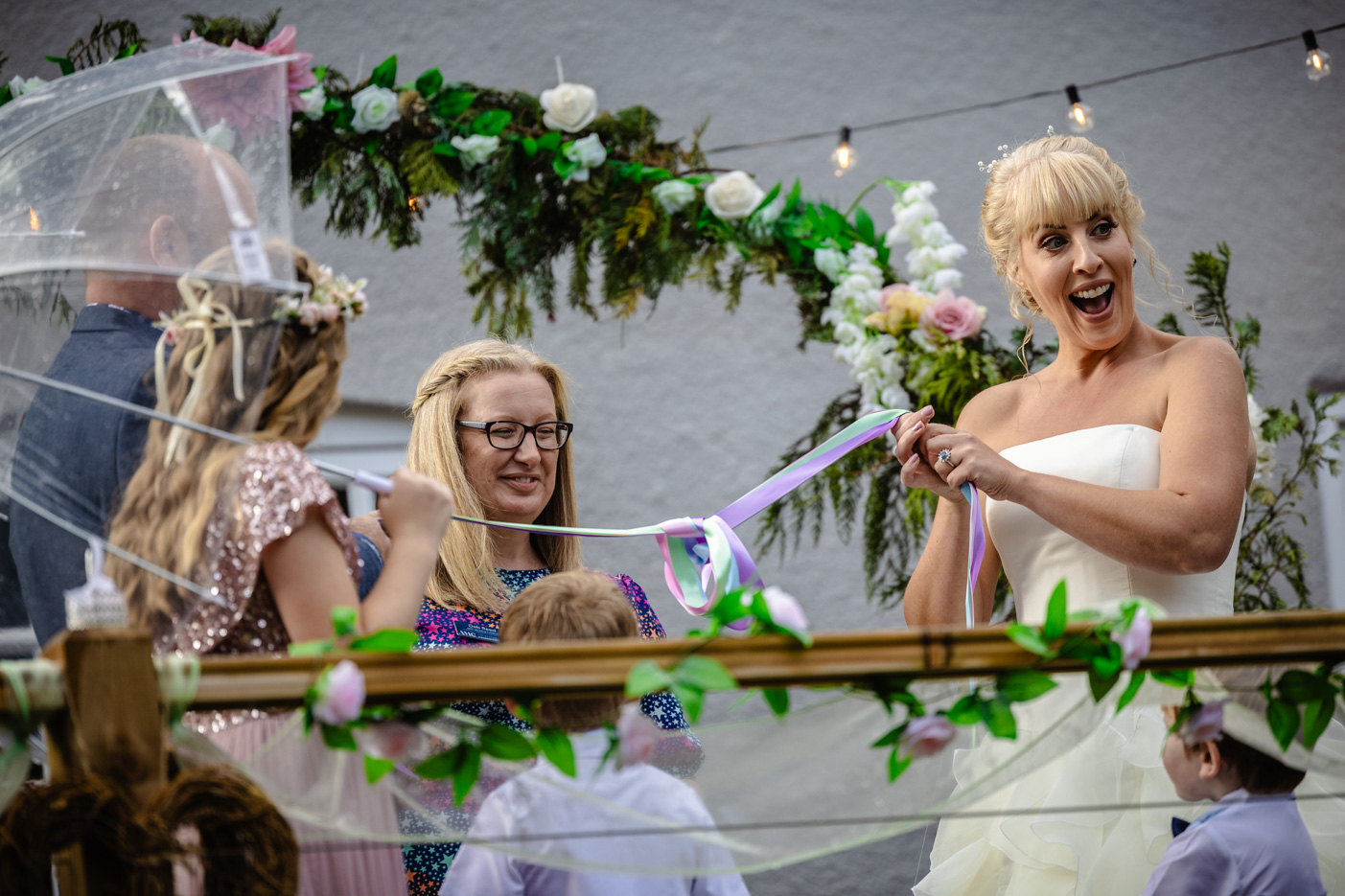 Deb Reed Celebrant Colchester Essex, playing the Mr & Mrs paddle game at the vowel renewal of Gary and Kelly.